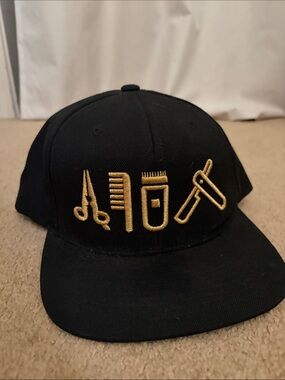 The Classic Black Cap with Gold Embroidered Grooming Icons